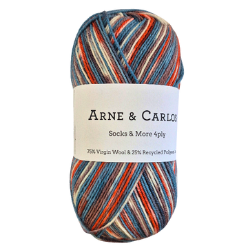 Multicolored skein of yarn with Arne & Carlos label on a white background