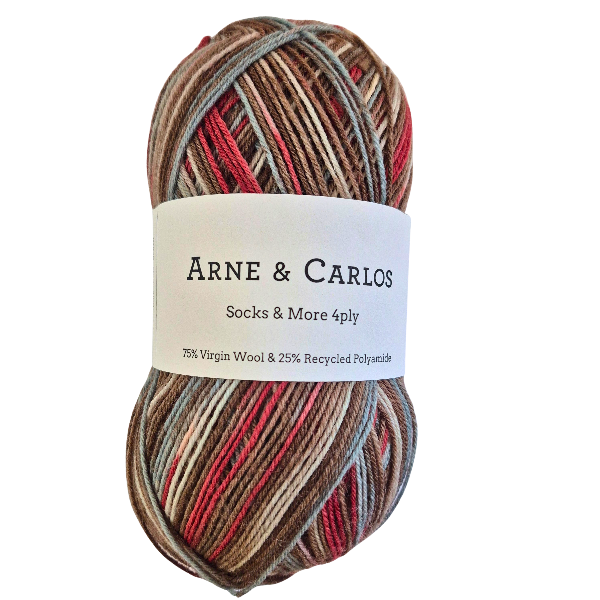 Multicolored skein of yarn with Arne & Carlos label on a white background
